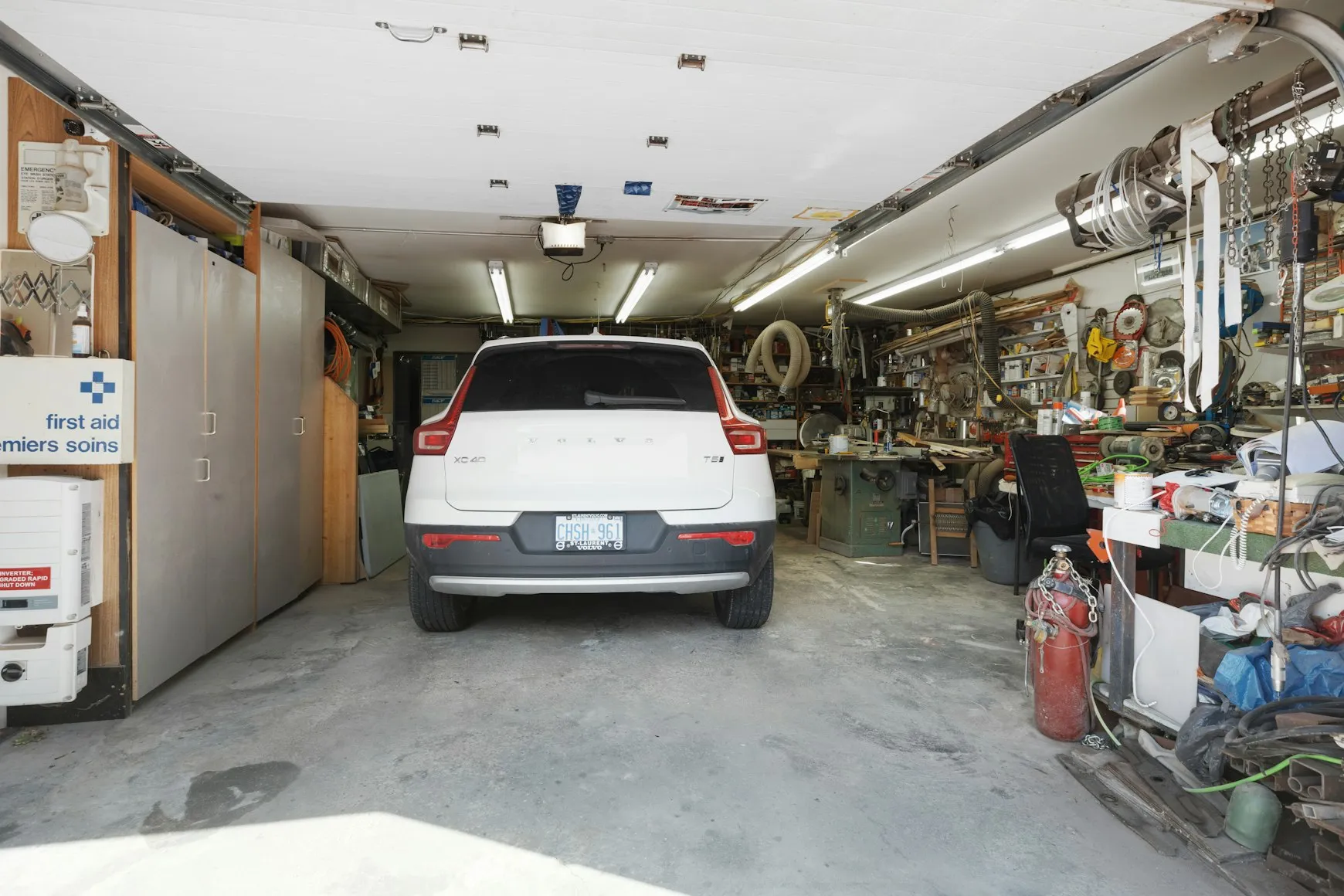 Professional technician performing residential garage door repair and maintenance service.