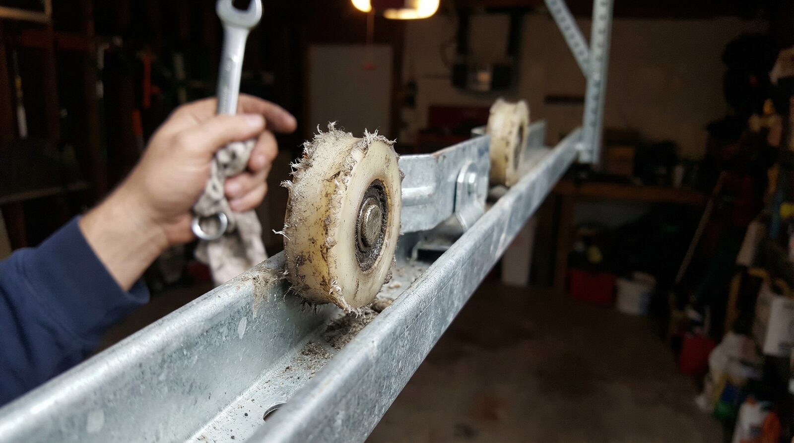 Worn garage door rollers needing replacement