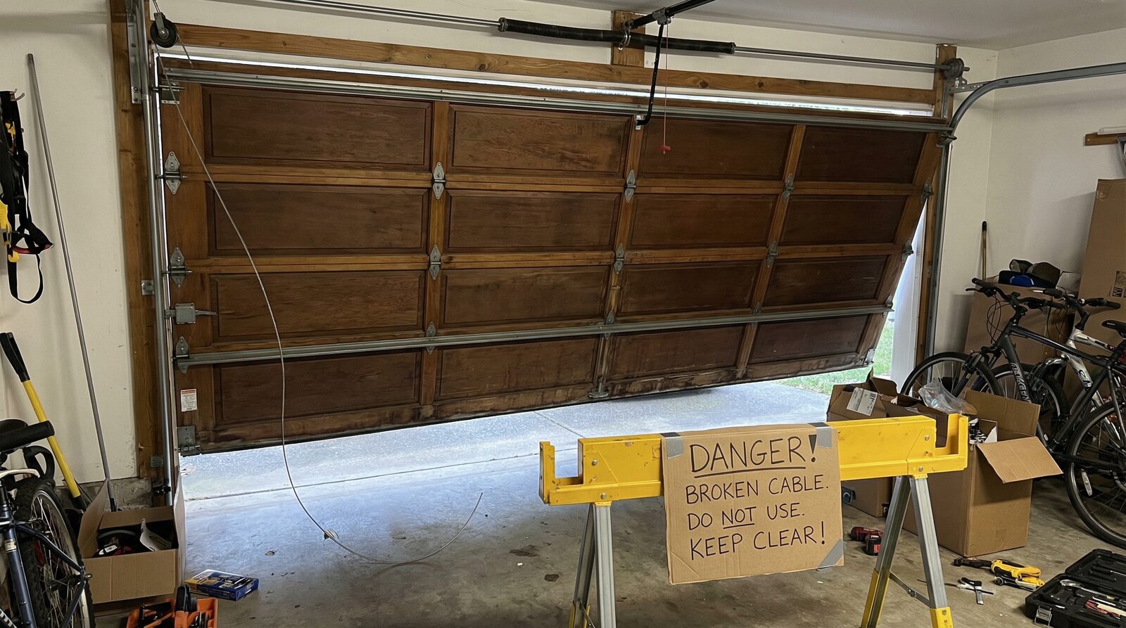 Garage door safety hazard with broken cable
