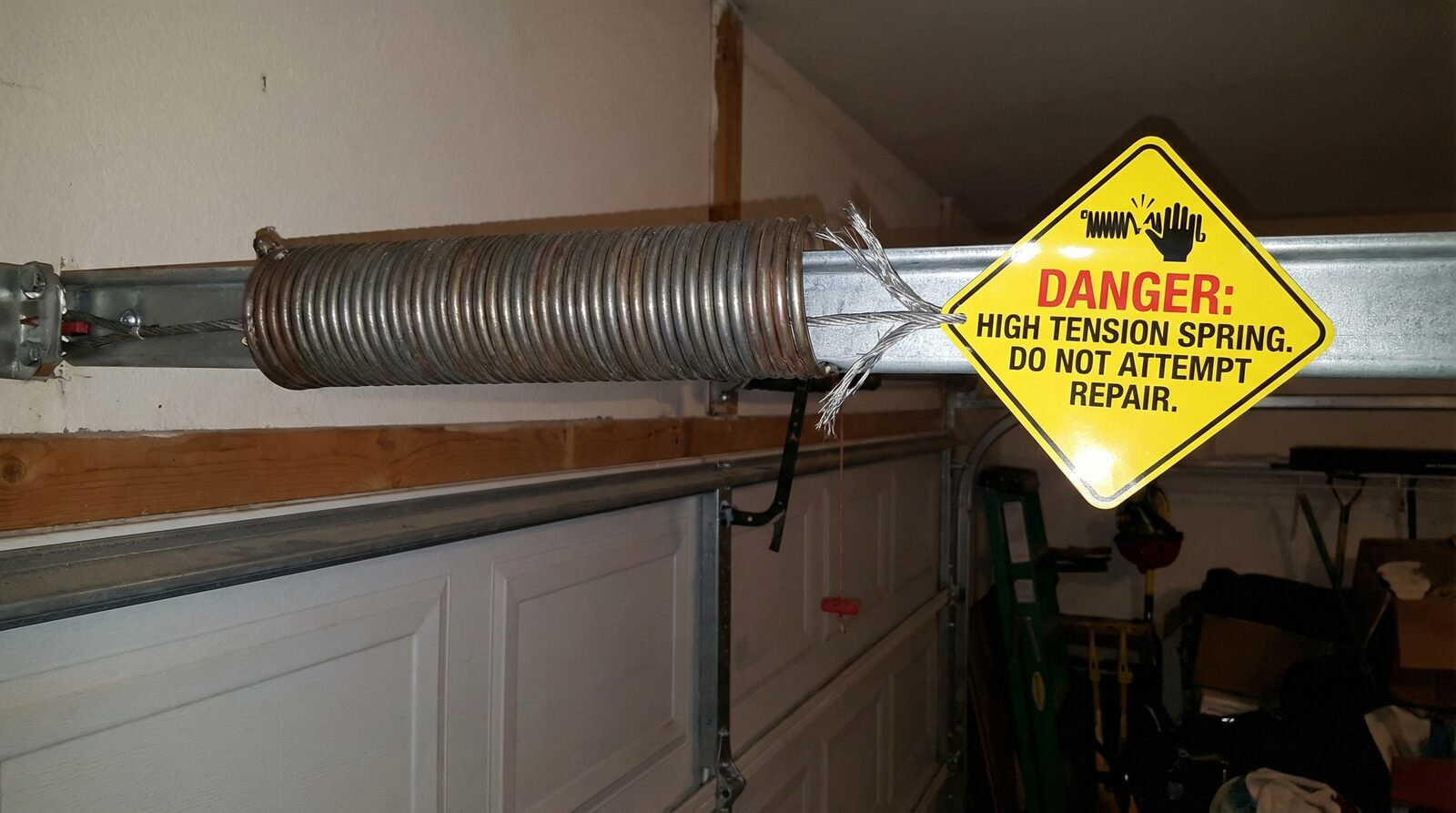 Can You Safely Open a Garage Door Manually with a Broken Spring? — featured article cover image.